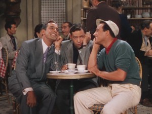 Henri and Jerry begin to sing "S'Wonderful" in the 1951 film. Meanwhile, Adam (Oscar Levant) has just worked out that both are in love with the same woman, and nervously pounds coffee and cigarettes.