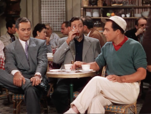Adam (Oscar Levant) drinks and smokes his nervousness while Henri and Jerry discuss their personal lives all too openly.